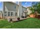 Large backyard with stone patio and seating area, ideal for relaxing and outdoor entertaining at 2713 Stillwater Lake Ln, Marietta, GA 30066