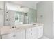Bright bathroom features a double sink vanity, and a large mirror reflecting a shower and bathtub at 2713 Stillwater Lake Ln, Marietta, GA 30066