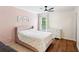 Charming bedroom featuring a polka dot comforter, hardwood floors, and a ceiling fan at 2713 Stillwater Lake Ln, Marietta, GA 30066
