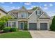Charming two-story home with a well-manicured lawn, inviting curb appeal and an attached two-car garage at 2713 Stillwater Lake Ln, Marietta, GA 30066
