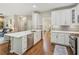 Spacious kitchen with a large island, stainless steel appliances, and a seamless transition to living areas at 2713 Stillwater Lake Ln, Marietta, GA 30066