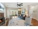 Spacious living room with stone fireplace, ceiling fan, open layout, and plenty of natural light at 2713 Stillwater Lake Ln, Marietta, GA 30066