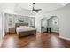 Spacious main bedroom with trey ceiling, modern ceiling fan, and hardwood floors at 2713 Stillwater Lake Ln, Marietta, GA 30066
