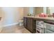 Bathroom with vanity, sink, and a large mirror for grooming at 7162 Fringe Flower Dr, Austell, GA 30168