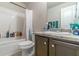 Bathroom with under sink storage, a toilet, and a shower and bathtub at 7162 Fringe Flower Dr, Austell, GA 30168