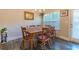 Dining room featuring an inviting wooden table, chandelier, and natural light at 7162 Fringe Flower Dr, Austell, GA 30168