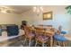 A Dining room with a wooden table with seating for six alongside the living room at 7162 Fringe Flower Dr, Austell, GA 30168