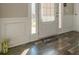Entryway with decorative molding, door and wooden floors at 7162 Fringe Flower Dr, Austell, GA 30168