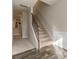 Bright entryway with staircase, neutral paint, and wood flooring at 7162 Fringe Flower Dr, Austell, GA 30168