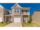 Charming townhome boasts a covered porch and attached garage at 7162 Fringe Flower Dr, Austell, GA 30168