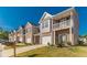Inviting townhome community featuring manicured lawns and attached garages at 7162 Fringe Flower Dr, Austell, GA 30168
