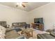 Cozy living room with ceiling fan, plush seating, and media center at 7162 Fringe Flower Dr, Austell, GA 30168