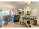 Open-concept living room and dining area with hardwood floors and abundant natural light at 7162 Fringe Flower Dr, Austell, GA 30168