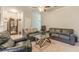 Comfortable living room with ample seating, carpet flooring, and neutral walls at 7162 Fringe Flower Dr, Austell, GA 30168
