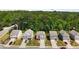 Aerial view of a neighborhood featuring well-maintained homes with lush greenery and mature trees at 9007 Jim Purcell Dr, Covington, GA 30014