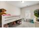 bedroom featuring a bunk bed, window and neutral colored carpet at 9007 Jim Purcell Dr, Covington, GA 30014