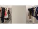 Walk-in closet providing ample storage space and organization with clothing racks on either side at 9007 Jim Purcell Dr, Covington, GA 30014