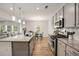 Kitchen featuring granite countertops, stainless steel appliances, a central island, and open-concept design at 9007 Jim Purcell Dr, Covington, GA 30014