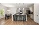 Beautiful kitchen with stainless steel appliances, granite countertops, and ample island seating at 9007 Jim Purcell Dr, Covington, GA 30014