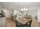 Bright kitchen features an island with seating, stainless appliances and an open floor plan at 9007 Jim Purcell Dr, Covington, GA 30014