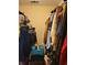 Walk-in closet featuring rods and shelves filled with clothes and storage items at 215 Boca Ciega Ct, Alpharetta, GA 30022