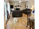 Open concept living room with fireplace, couches, and pet friendly with hard wood floors at 215 Boca Ciega Ct, Alpharetta, GA 30022