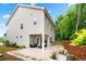 Spacious backyard showcasing a covered patio with outdoor furniture at 2939 Woodward Down Trl, Buford, GA 30519