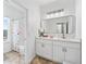 Bright bathroom with double vanity and a shower-tub combo at 2939 Woodward Down Trl, Buford, GA 30519
