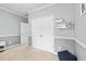 Neutral-toned bedroom featuring a double door closet and soft carpet at 2939 Woodward Down Trl, Buford, GA 30519