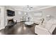 Bright living room with fireplace, wood floors, and white sofa at 2939 Woodward Down Trl, Buford, GA 30519