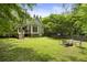 Expansive backyard with a firepit and lush landscaping at 4404 Old Georgetown Trl, Atlanta, GA 30338