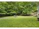 Manicured backyard with an outdoor seating area and playset at 4404 Old Georgetown Trl, Atlanta, GA 30338