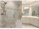 Sleek bathroom featuring a glass-enclosed shower with tile surround and white cabinetry at 4404 Old Georgetown Trl, Atlanta, GA 30338
