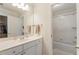 Clean and bright bathroom featuring a white vanity, tub, and tiled shower at 4404 Old Georgetown Trl, Atlanta, GA 30338