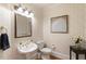 Elegant powder room featuring patterned wallpaper, stylish fixtures, and a decorative mirror at 4404 Old Georgetown Trl, Atlanta, GA 30338