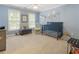 Charming Bedroom painted light blue with two windows and featuring a crib at 4404 Old Georgetown Trl, Atlanta, GA 30338