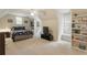 Spacious bedroom featuring carpet, neutral walls, built-in shelves, and a cozy window bench at 4404 Old Georgetown Trl, Atlanta, GA 30338