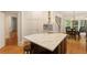 Gourmet kitchen with island, white cabinets, stainless steel appliances, and eat-in area at 4404 Old Georgetown Trl, Atlanta, GA 30338