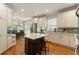 Spacious eat-in kitchen with island, stainless steel appliances, and white cabinetry at 4404 Old Georgetown Trl, Atlanta, GA 30338