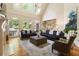 Bright and airy living room with high ceilings, large windows, and comfortable seating at 4404 Old Georgetown Trl, Atlanta, GA 30338