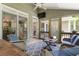 Inviting screened-in patio with comfortable seating and ceiling fan, great for entertaining at 4404 Old Georgetown Trl, Atlanta, GA 30338