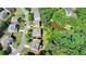 Aerial view of a house situated on a green lawn and close to a tranquil pond at 4885 Maristone Landing Way, Cumming, GA 30040