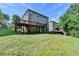Back of house features a spacious deck, a walk-out basement and lush landscaping at 4885 Maristone Landing Way, Cumming, GA 30040