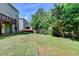 Backyard with a newly installed lawn and wooded views at 4885 Maristone Landing Way, Cumming, GA 30040