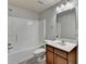 Bright bathroom featuring a shower-tub combo and a modern vanity with storage at 4885 Maristone Landing Way, Cumming, GA 30040