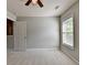 Bright bedroom featuring neutral walls, plush carpeting, and a window at 4885 Maristone Landing Way, Cumming, GA 30040