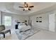 Cozy bedroom featuring a ceiling fan, carpet, neutral color palette, and decor at 4885 Maristone Landing Way, Cumming, GA 30040