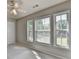 Bedroom featuring carpeted flooring, ceiling fan, and bright windows at 4885 Maristone Landing Way, Cumming, GA 30040