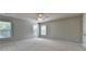 Spacious bedroom with neutral walls, plush carpeting, and natural light streaming through large windows at 4885 Maristone Landing Way, Cumming, GA 30040