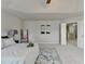 Bedroom featuring a tray ceiling, ceiling fan, carpet, neutral color palette, and decor at 4885 Maristone Landing Way, Cumming, GA 30040